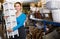 Woman with nightstand with basket i in furniture shop