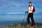 Woman on Nordic Walking in mountains