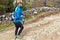 Woman nordic walking on trail