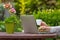 Woman with notebook on the garden