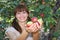 A woman offering apples