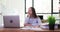 Woman office worker falls asleep during online business meeting