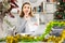 Woman office worker with wage packet in Christmas decorated office