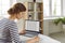 Woman office worker is working with spreadsheet on computers screens and making notes.