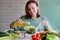 Woman oiling salad. Kitchen ingredients. Ready to eat. Healthy lifestyle. Vegan menu. Spring vitamins. Summer season. Detox. Eat