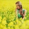 Woman on oilseed field