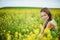 Woman on oilseed field