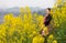 Woman and oilseed flower