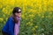 Woman and oilseed flower