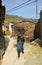 Woman older carrying firewood, Hurdes, Caceres province, Spain