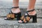 Woman with open high heel shoes with fringes before Salvatore Ferragamo fashion show, Milan Fashion Week