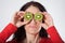 Woman with open kiwis on eye