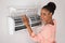 Woman Opening Air Conditioner