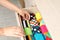 Woman opening drawer with different colorful socks