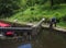 A woman opening a lock gate on the rochdale canal in hebden bridge west yorkshire