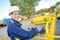 Woman operating controls cherry picker bucket