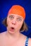 Woman with an orange swim cap