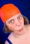 Woman with an orange swim cap