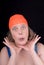 Woman with an orange swim cap