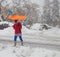 Woman with orange umbrella in Jerusalem