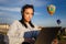 Woman ordering hot air balloon tour by laptop