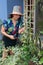 Woman organizing the decoration of the exterior of the house. Urban Jungle