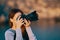 woman outdoors in the mountains holding a camera landscape fresh air