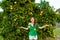 Woman outdoors at sunset in a orange orchard