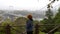 Woman overlooking Bosphorus on Fatih Sultan Mehmet Bridge, Istanbul, Turkey