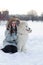 Woman owner hugging white Samoyed dog