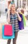 Woman with packages after shopping in the city