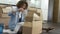 Woman Packing Boxes Ready For House Move