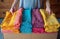 Woman packing colorful towels atop a box, packing and decluttering photo