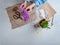 Woman packing spring potted flowers as gifts, top view, with copy space