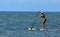 Woman on a paddle board in the Gulf of Mexico