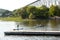 Woman on paddle board and man in kayak moving into the Cap-Rouge River from the St. Lawrence River