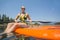 Woman paddleboarding on scenic lake low angle view