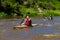 Woman Paddling Canoe Race