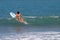 Woman Paddling a Surfboard in Costa Rica