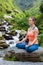 Woman in Padmasana outdoors