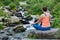 Woman in Padmasana outdoors