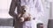 Woman paediatrician holding teddy bear toy, close up view