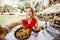 Woman with paella dish in Valencia