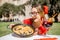 Woman with Paella dish in Valencia