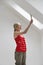 Woman Painting Ceiling Slope