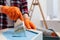 Woman painting honeycomb shaped shelf with brush indoors, closeup. Space for text