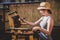 Woman painting a wooden chair, repair and renovation