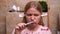 Woman in pajamas with earplug anger from noise, brushes her teeth, loses control