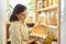 Woman in pantry taking products, eggs. Food storage, cooking at home