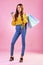 Woman with paper bag, shopping and happy with credit card for payment, retail and commerce on pink background. Customer